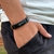 PULSEIRA DE COURO PRETO AJUSTÁVEL (JESUS BRANCO)