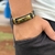 PULSEIRA DE COURO PRETO AJUSTÁVEL (DEUS É FIEL DOURADO)