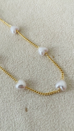 Chocker pérolas de coração na internet