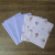 Pacote com 3 folhas de papel de seda lilás liso e 3 lilás estampada