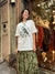Camiseta over size pássaro verde na internet