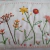 Almofada infantil bordada em flores na cor branca 40x20 - comprar online