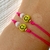 Pulsera happy face fucsia en internet