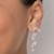 Brinco pêndulo panapaná banhado a ouro 18k com zircônias e aplicação de rhodium na internet