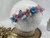 Tiara jardim azul e rosa