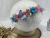 Tiara jardim azul e rosa