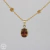 Pingente de andaluzita. Ouro amarelo 18k