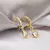 BRINCO CLIC GOTA CRISTAL OURO 730