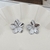 Aretes flor plateados