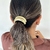 Accesorio para el cabello doble dorado en internet