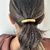 Accesorio para el cabello dorado en internet