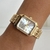 Reloj semi cuadrado dorado