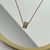 Cadena con dije de zirconias