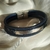 Pulsera simil cuero azul, tres tiras con detalles y cierre en AQ