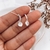Aros pasantes con cubic y colgante cristal. En Plata 925
