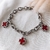 Pulsera con cruces en rojo en AQ