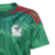 Camisa Adidas verde da seleção mexicana, com detalhes em vermelho e emblema da equipe.