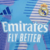 Camisa azul do goleiro do Real Madrid, com logo da Adidas e patrocínio da Emirates, destacando estampas geométricas.