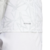 Detalhe da camisa Real Madrid Pré-jogo 24/25, mostrando a tecnologia AEROREADY e o design em branco com detalhes cinzas.