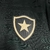 Emblema da camisa do Botafogo II 24/25, apresentando um escudo preto com uma estrela dourada.