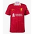 Camisa vermelha do Liverpool, modelo 24/25, com logo da Nike e patrocinador Standard Chartered.