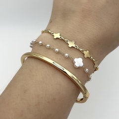 Pulseira Mini Trevo Metal Dourado na internet
