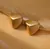 Aretes triángulo dorado mate acero inox 1C6