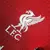 Camisa Liverpool I 23/24, Camisa Nike masculina Liverpool, Camisa vermelha Liverpool 2023, Camisa de jogador Liverpool Nike, Camisa oficial Liverpool 23/24, Camisa com detalhes em branco Liverpool, Comprar camisa Liverpool online, Camisa de futebol Liverp