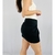 Saia preta com bolsos TAM P - Qnova Second Hand