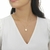 Colar Relicário Love circular minimalista dourado banhado à ouro 18k na internet