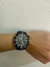 Reloj Grand Touring con numeros en blanco en internet
