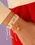 Set X4 Pulseras Tejida Naranja + Aretes - comprar online