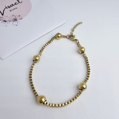 Pulsera de acero dorado box bolitas en internet