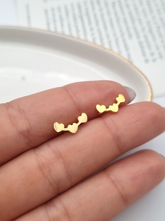 Aros de acero dorado 3 corazones