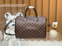 Bolsa baú Louis Vuitton