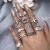 Set Anillos Plateados x12 -5