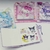 Mini caderninho chaveiro de adesivos e anotações - Sanrio na internet