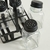 Set x4 Especieros Tapa Negra en Rack de Metal Negro en internet