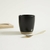 Set x 4 copetineros de porcelana negra, base de bamboo y cucharitas doradas 30X8 CM en internet