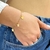 Pulseira com pingente de borboletas lisas