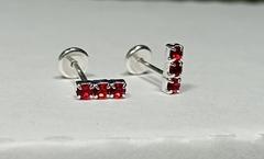 Abridores. Diseño lineas de 3 mini circonias rojas.