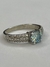 Anel solitário modinha moissanite azul 6,5MM e brancas 1,3MM na internet