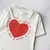REMERA OVER L’AMOUR BLANCA en internet