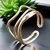 Anel Feminino Ajustável Dourado com Design Ondulado - comprar online