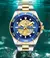 Relógio Curren Luxo Masculino com design mecânico, mostrador em azul e detalhes dourados, à prova d'água.