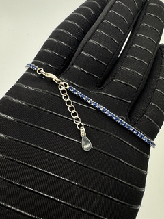 Pulsera tenis con zirconias negras/azul en plata .925 nacional.