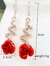 1 par de aretes largos con diseño de diamante imitación de flor - ósea
