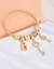 1 brazalete con diamante de imitación clave y con diseño de cerradura