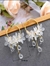 Aretes con flores y gotas de lluvia