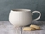 TAZA DE STONEWARE 350ML CON DISENO DE RELIEVE ESTILO PANAL CREMA APTO PARA MICROONDAS Y LAVAVAJILLAS 9X13CM en internet
